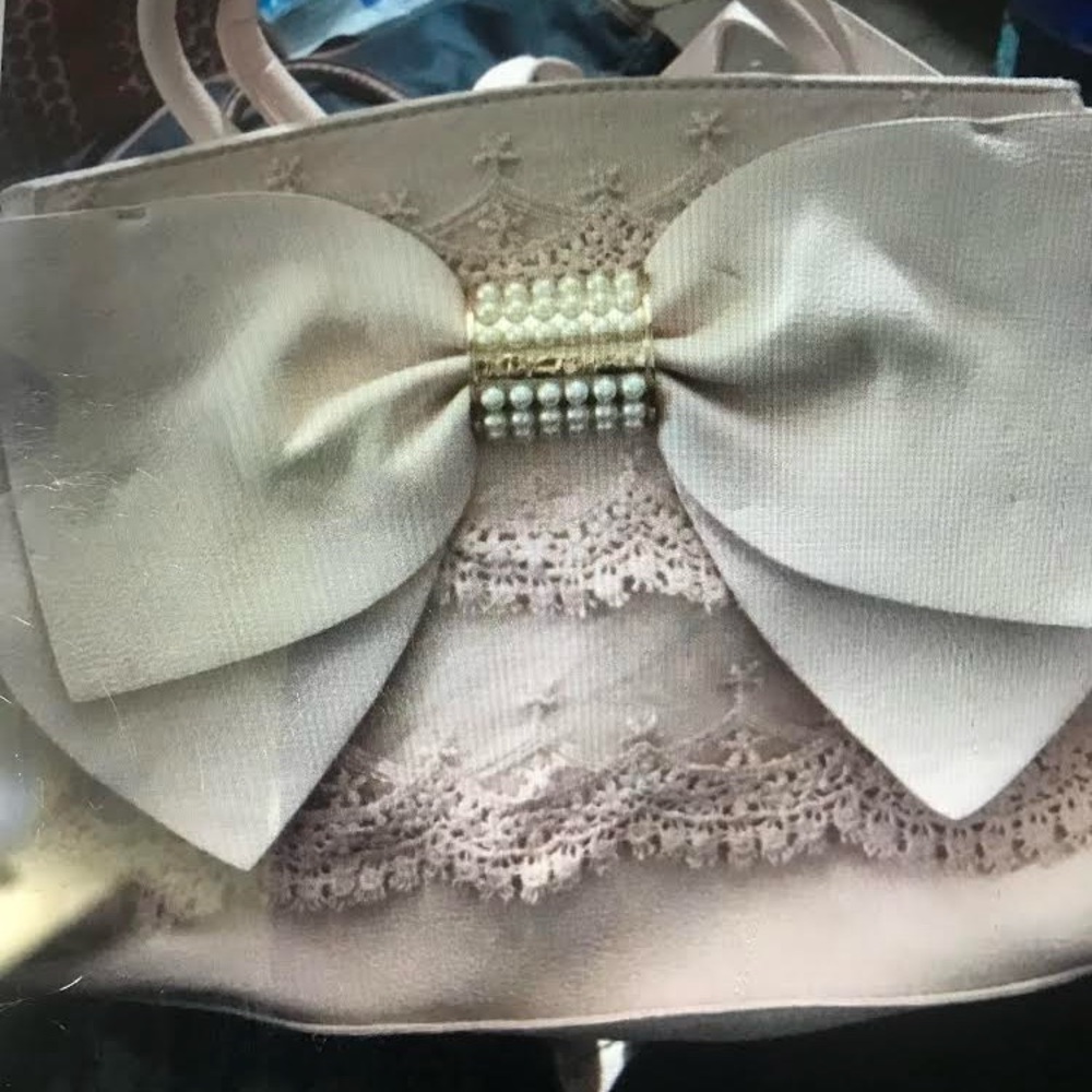 Betsy Johnson pink bow purse gently used